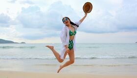 Tourist jumping on the Beach P